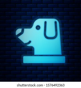 Glowing neon Dog in astronaut helmet icon isolated on brick wall background.  Vector Illustration