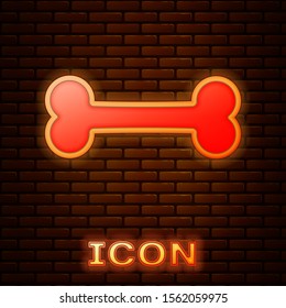 Glowing neon Dog bone icon isolated on brick wall background. Pets food symbol.  Vector Illustration