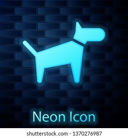 Glowing neon Dog icon isolated on brick wall background. Vector Illustration