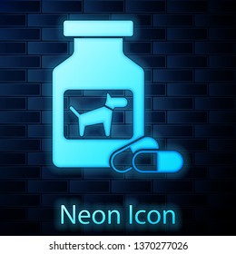 Glowing neon Dog medicine bottle and pills icon isolated on brick wall background. Container with pills. Prescription medicine for animal. Vector Illustration