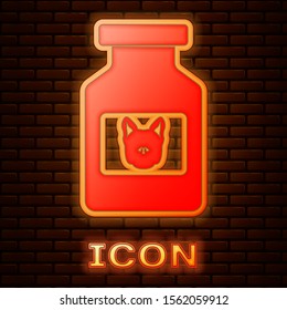 Glowing neon Dog medicine bottle icon isolated on brick wall background. Container with pills. Prescription medicine for animal.  Vector Illustration