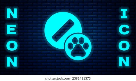Glowing neon Dog pill icon isolated on brick wall background. Prescription medicine for animal.  Vector