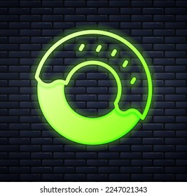 Glowing neon Donut with sweet glaze icon isolated on brick wall background.  Vector