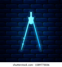 Glowing neon Drawing compass icon isolated on brick wall background. Compasses sign. Drawing and educational tools. Geometric instrument. Education sign. Vector Illustration