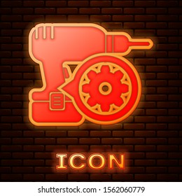 Glowing neon Drill machine and gear icon isolated on brick wall background. Adjusting app, service concept, setting options, maintenance, repair, fixing.  Vector Illustration