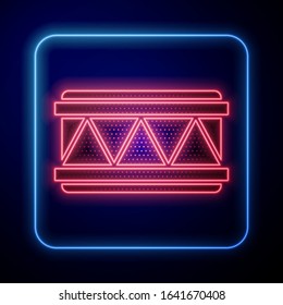 Glowing neon Drum icon isolated on blue background. Music sign. Musical instrument symbol.  Vector Illustration