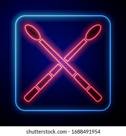 Glowing neon Drum sticks icon isolated on blue background. Musical instrument.  Vector Illustration