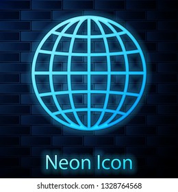 Glowing neon Earth globe icon isolated on brick wall background. Vector Illustration