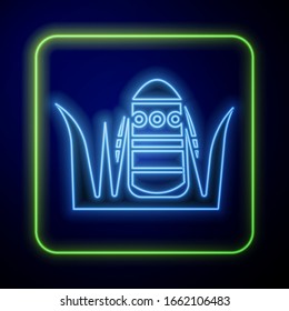 Glowing neon Easter egg icon isolated on blue background. Happy Easter.  Vector Illustration