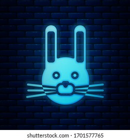 Glowing neon Easter rabbit icon isolated on brick wall background. Easter Bunny.  Vector Illustration