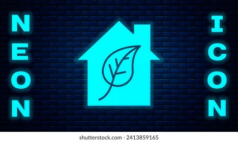 Glowing neon Eco friendly house icon isolated on brick wall background. Eco house with leaf.  Vector