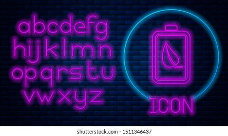 Glowing neon Eco nature leaf and battery icon isolated on brick wall background. Energy based on ecology saving concept. Neon light alphabet. Vector Illustration