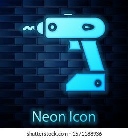 Glowing neon Electric cordless screwdriver icon isolated on brick wall background. Electric drill machine. Repair tool.  Vector Illustration