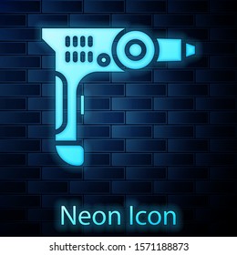 Glowing neon Electric drill machine icon isolated on brick wall background. Repair tool.  Vector Illustration