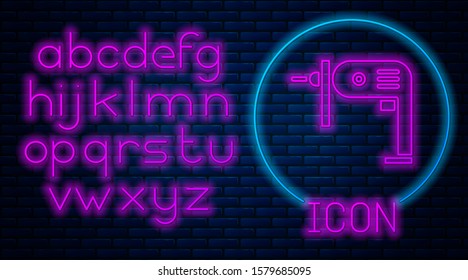 Glowing neon Electric drill machine icon isolated on brick wall background. Repair tool. Neon light alphabet. Vector Illustration