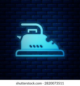 Glowing neon Electric iron icon isolated on brick wall background. Steam iron.  Vector