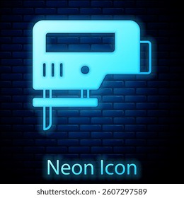 Glowing neon Electric jigsaw with steel sharp blade icon isolated on brick wall background. Power tool for woodwork.  Vector