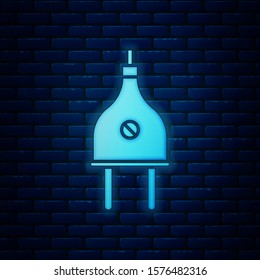 Glowing neon Electric plug icon isolated on brick wall background. Concept of connection and disconnection of the electricity.  Vector Illustration
