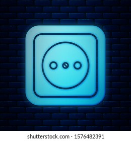 Glowing neon Electrical outlet icon isolated on brick wall background. Power socket. Rosette symbol.  Vector Illustration