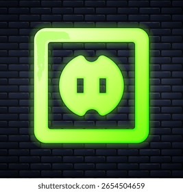 Glowing neon Electrical outlet icon isolated on brick wall background. Power socket. Rosette symbol.  Vector