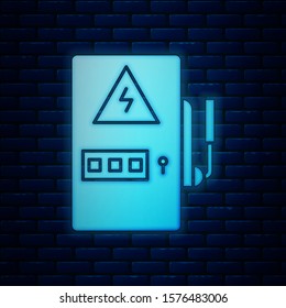 Glowing neon Electrical panel icon isolated on brick wall background.  Vector Illustration