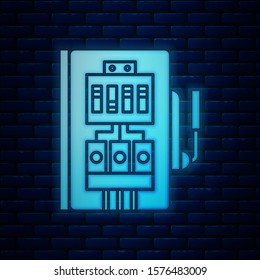 Glowing neon Electrical panel icon isolated on brick wall background.  Vector Illustration