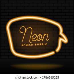 Glowing neon empty speech bubble frame. Rectangle blank speech bubble in neon style on dark brick wall background. Vector illustration.