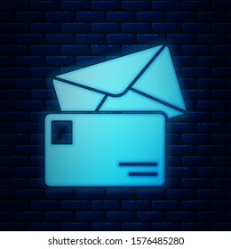Glowing neon Envelope icon isolated on brick wall background. Email message letter symbol.  Vector Illustration