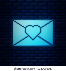 Glowing neon Envelope with Valentine heart icon isolated on brick wall background. Message love. Letter love and romance.  Vector