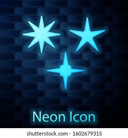 Glowing neon Falling star icon isolated on brick wall background. Meteoroid, meteorite, comet, asteroid, star icon.  Vector Illustration