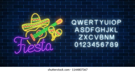 Glowing neon fiesta holiday sign on dark brick wall background with alphabet. Mexican festival flyer design with guitar, maracas and sombrero hat. Vector illustration.