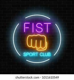 Glowing neon fighting sport club sign in circle frame on dark brick wall background. Boxing club neon signboard. Nightlife advertising symbol of sport facility on fighting theme . Vector illustration.