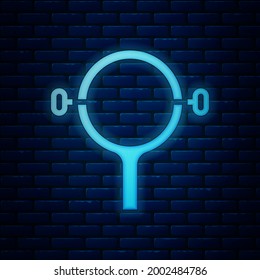 Glowing neon Filter wrench icon isolated on brick wall background. The key for tightening the bulb filter trunk.  Vector