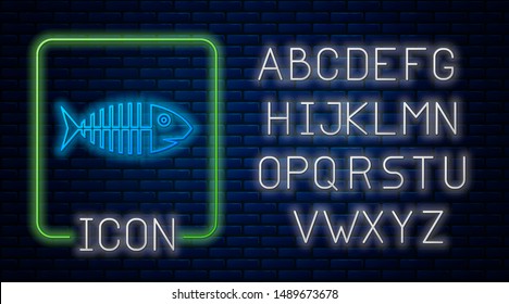 Glowing neon Fish skeleton icon isolated on brick wall background. Fish bone sign. Neon light alphabet. Vector Illustration