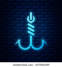Glowing neon Fishing hook icon isolated on brick wall background. Fishing tackle.  Vector Illustration