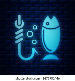 Glowing neon Fishing icon isolated on brick wall background. Fish and hook. Strategy concept. Bait sign.  Vector Illustration