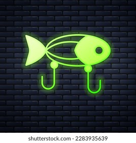 Glowing neon Fishing lure icon isolated on brick wall background. Fishing tackle.  Vector