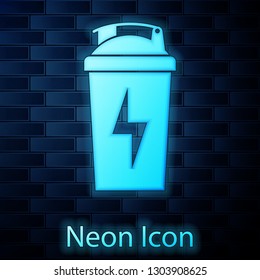 Glowing neon Fitness shaker icon isolated on brick wall background. Sports shaker bottle with lid for water and protein cocktails. Vector Illustration