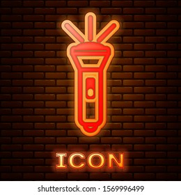 Glowing neon Flashlight icon isolated on brick wall background.  Vector Illustration