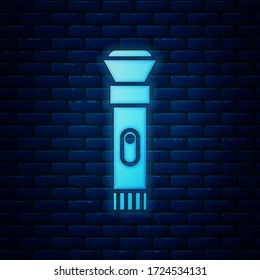 Glowing neon Flashlight icon isolated on brick wall background.  Vector Illustration