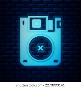 Glowing neon Floppy disk for computer data storage icon isolated on brick wall background. Diskette sign.  Vector
