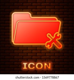 Glowing neon Folder with screwdriver and wrench icon isolated on brick wall background. Adjusting, service, setting, maintenance, repair, fixing.  Vector Illustration