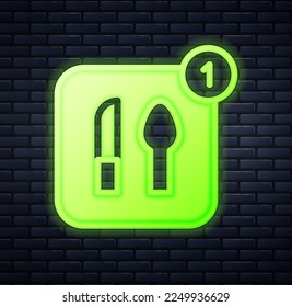 Glowing neon Food ordering icon isolated on brick wall background. Order by mobile phone. Restaurant food delivery concept.  Vector