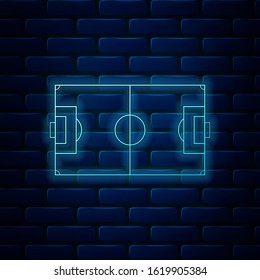 Glowing neon Football field or soccer field icon isolated on brick wall background.  Vector Illustration