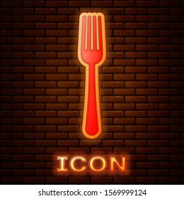 Glowing neon Fork icon isolated on brick wall background. Cutlery symbol.  Vector Illustration