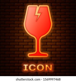 Glowing neon Fragile broken glass symbol for delivery boxes icon isolated on brick wall background.  Vector Illustration