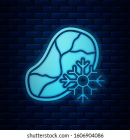 Glowing neon Fresh frozen steak meat icon isolated on brick wall background.  Vector Illustration