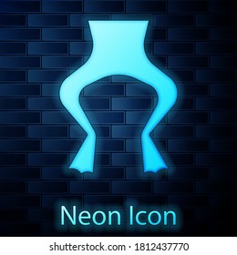 Glowing neon Frog legs icon isolated on brick wall background. Vector.