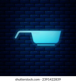 Glowing neon Frying pan icon isolated on brick wall background. Fry or roast food symbol.  Vector