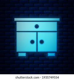 Glowing neon Furniture nightstand icon isolated on brick wall background.  Vector